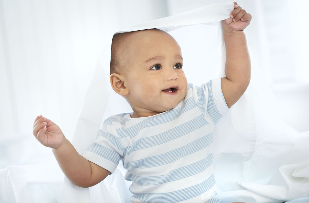 a happy baby playing